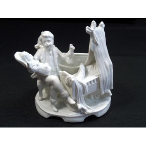 Father bisque stage and her child in the cradle