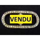 Old brooch decorated with rhinestones