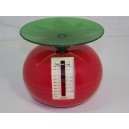 Vintage kitchen scale in the shape of a tomato