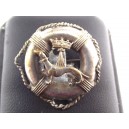 Old silver metal brooch depicting an ermine, a crown, a buoy