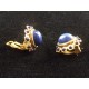 Paire de boucles d'oreilles clips en métal doré couture marque Rossi