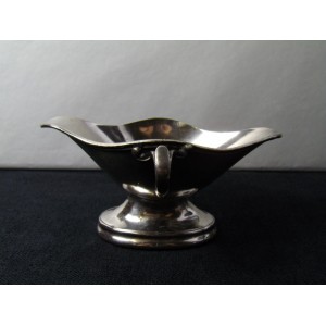 Old metal silver sauceboat