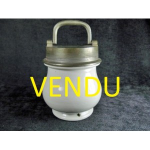 Old porcelain jar with metal screw cap